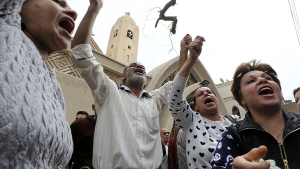 Relatives of victims react in front of a Coptic church that was bombed on Sunday in Tanta, Egypt, April 9, 2017 - Sputnik International