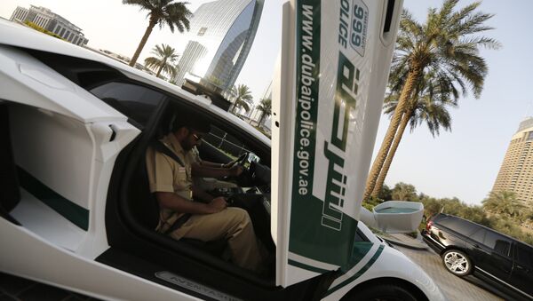 Emirati policemen patrol in an especially modified Lamborghini Aventador on April 16, 2013 in the Gulf emirate of Dubai - Sputnik International