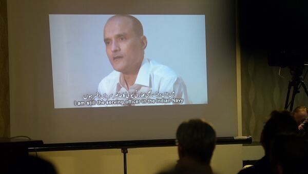 In this photograph taken on March 29, 2016, Pakistani journalists watch a video showing Indian national Kulbhushan Yadav, arrested on suspicion of spying, during a press conference in Islamabad - Sputnik International