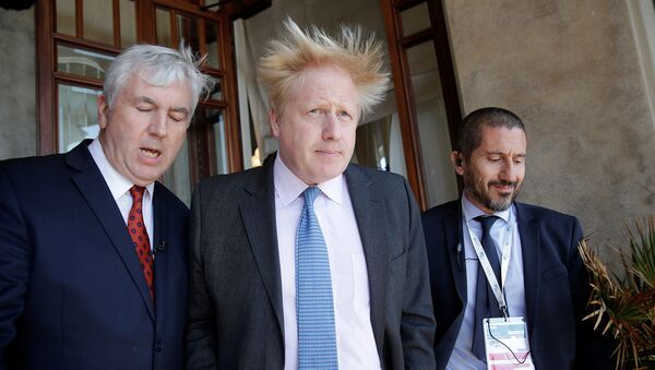 Britain's Foreign Secretary Boris Johnson (C) leaves at the end of a bilateral meeting during a G7 for foreign ministers in Lucca, Italy April 10, 2017 - Sputnik International