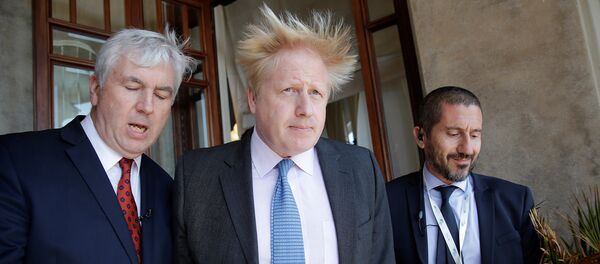 Britain's Foreign Secretary Boris Johnson (C) leaves at the end of a bilateral meeting during a G7 for foreign ministers in Lucca, Italy April 10, 2017 - Sputnik International