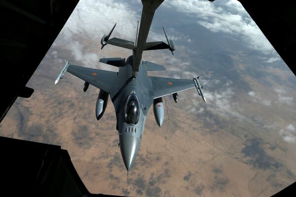 A Belgian Air Force F-16 receives fuel from a fuel boom suspended from a US Air Force KC-10 Extender during mid-air refueling support to Operation Inherent Resolve over Iraq and Syria air space, March 15, 2017 A Belgian Air Force F-16 receives fuel from a fuel boom suspended from a US Air Force KC-10 Extender during mid-air refueling support to Operation Inherent Resolve over Iraq and Syria air space, March 15, 2017 - Sputnik International
