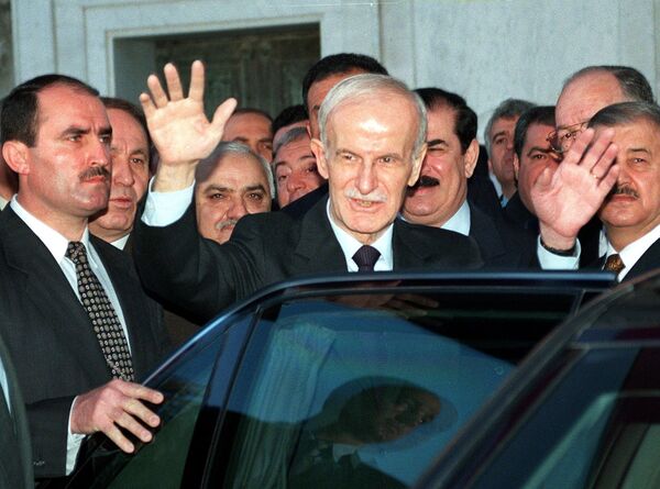 Syrian president Hafez al-Assad salutes people after attending Eid Al-Adha, or feast of sacrifice, prayers 27 March 1999 in Damascus Syrian president Hafez al-Assad salutes people after attending Eid Al-Adha, or feast of sacrifice, prayers 27 March 1999 in Damascus - Sputnik International