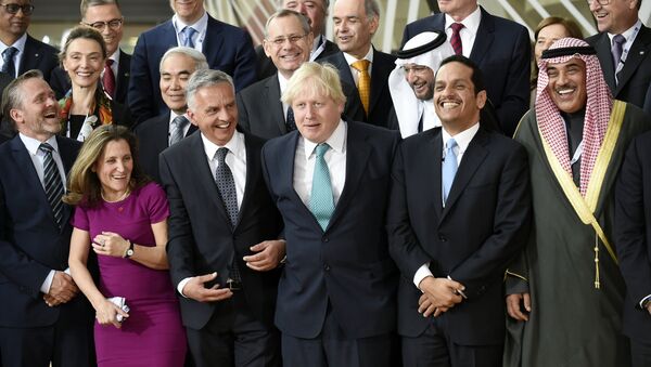 (Front row L-R) Denmark's Foreign Minister Anders Samuelsen, Canada's Foreign Minister Chrystia Freeland, Switzerland's Federal Councillor Didier Burkhalter, British Foreign Secretary Boris Johnson, Qatar's Foreign Minister Mohammed bin Abdulrahman al-Than and Kuwaiti Foreign Minister Sabah Al Khalid Al Sabah pose along with other delegates for a group photo during a conference on Syria and the region at the Europa Building in Brussels on April 5, 2016 - Sputnik International