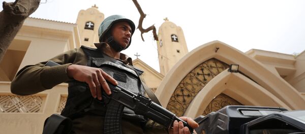 An armed policeman secures the Coptic church that was bombed on Sunday in Tanta, Egypt April 10, 2017 - Sputnik International