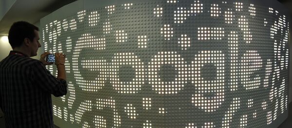 A visitor takes a picture with his mobile phone at the stand of Google on the second day of the Mobile World Congress on February 28, 2017 in Barcelona - Sputnik International