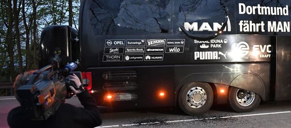 A camera man films Dortmund's team bus after it was damaged in an explosion before the Champions League quarterfinal soccer match between Borussia Dortmund and AS Monaco in Dortmund, western Germany, Tuesday, April 11, 2017. A camera man films Dortmund's team bus after it was damaged in an explosion before the Champions League quarterfinal soccer match between Borussia Dortmund and AS Monaco in Dortmund, western Germany, Tuesday, April 11, 2017. - Sputnik International