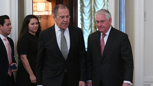 Russian Foreign Minister Sergei Lavrov and U.S. Secretary of State Rex Tillerson enter a hall during their meeting in Moscow, Russia, April 12, 2017 - Sputnik International