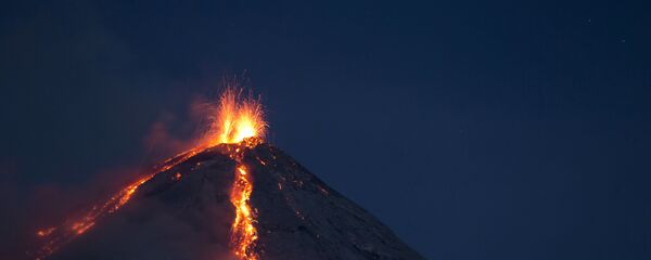 Volcan de Fuego, or Volcano of Fire, spews hot molten lava from its crater in San Juan Alotenango, Guatemala, Wednesday, July 1, 2015. Volcan de Fuego, or Volcano of Fire, spews hot molten lava from its crater in San Juan Alotenango, Guatemala, Wednesday, July 1, 2015. - Sputnik International