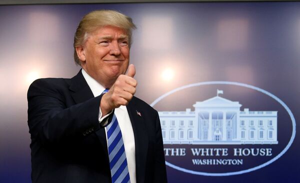 U.S. President Donald Trump gives a thumbs up as he hosts a CEO town hall on the American business climate at the Eisenhower Executive Office Building in Washington, U.S., April 4, 2017 - Sputnik International