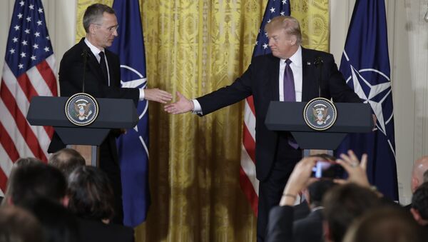 President Donald Trump reaches to shake hands with NATO Secretary General Jens Stoltenberg during a news conference in the East Room of the White House, Wednesday, April 12, 2017, in Washington. - Sputnik International