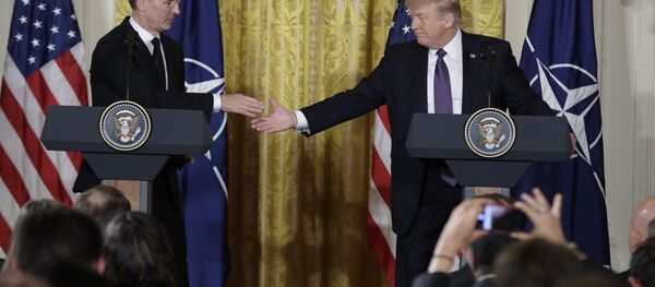 President Donald Trump reaches to shake hands with NATO Secretary General Jens Stoltenberg during a news conference in the East Room of the White House, Wednesday, April 12, 2017, in Washington. President Donald Trump reaches to shake hands with NATO Secretary General Jens Stoltenberg during a news conference in the East Room of the White House, Wednesday, April 12, 2017, in Washington. - Sputnik International
