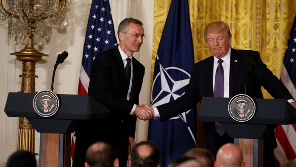 U.S. President Donald Trump (R) and NATO Secretary General Jens Stoltenberg shake hands during a joint news conference in the East Room at the White House in Washington, U.S., April 12, 2017. - Sputnik International