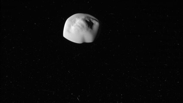 Atlas, the flying saucer moon of Saturn. Photo taken by NASA's Cassini Probe. - Sputnik International