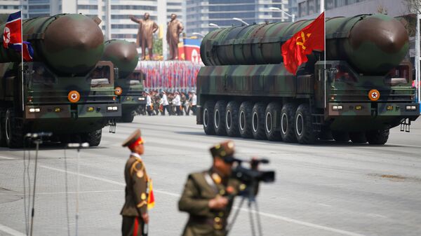 Missiles are driven past the stand with North Korean leader Kim Jong Un and other high ranking officials during a military parade marking the 105th birth anniversary of country's founding father Kim Il Sung, in Pyongyang April 15, 2017 - Sputnik International