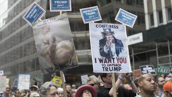 Demonstrators participate in a march and rally to demand President Donald Trump release his tax returns, Saturday, April 15, 2017, in New York - Sputnik International