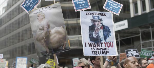 Demonstrators participate in a march and rally to demand President Donald Trump release his tax returns, Saturday, April 15, 2017, in New York Demonstrators participate in a march and rally to demand President Donald Trump release his tax returns, Saturday, April 15, 2017, in New York - Sputnik International