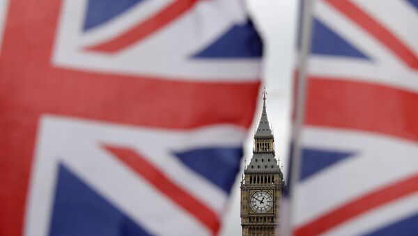 British Union flags displayed on a tourist stall, backdropped by the Elizabeth Tower at the Houses of Parliament, in central London, Wednesday, March 29, 2017. - Sputnik International