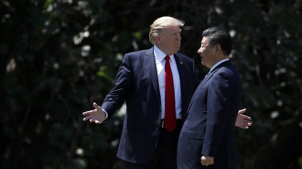 President Donald Trump gestures as he and Chinese President Xi Jinping walk together after their meetings at Mar-a-Lago in Palm Beach, Fla - Sputnik International