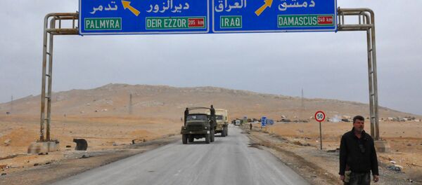 A picture taken on March 2, 2017, shows a sign displaying the routes to Palmyra-Deir Ezzor and Damascus-Iraq - Sputnik International
