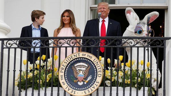 U.S. President Donald Trump stands with his son Barron (L-R), first lady Melania Trump and a performer in an Easter Bunny costume on the Truman Balcony during the White House Easter Egg Roll in Washington, U.S., April 17, 2017 - Sputnik International