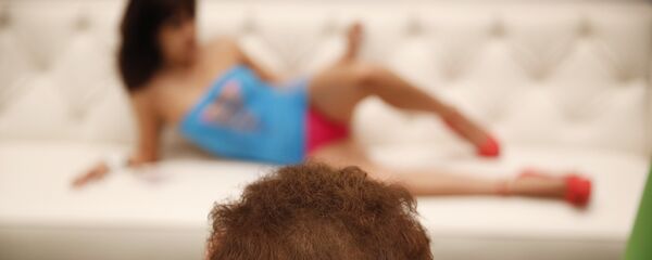 a man takes a picture of a woman at the AVN Adult Entertainment Expo in Las Vegas. a man takes a picture of a woman at the AVN Adult Entertainment Expo in Las Vegas. - Sputnik International