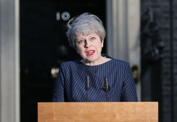 British Prime Minister Theresa May speaks to the media outside 10 Downing Street in central London on April 18, 2017. British Prime Minister Theresa May speaks to the media outside 10 Downing Street in central London on April 18, 2017. - Sputnik International