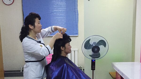 A woman in a hair salon which opened at one of the advanced industrial facilities in Pyongyang - Sputnik International