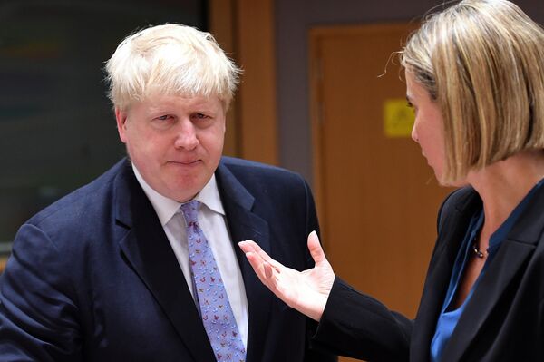 British foreign minister Boris Johnson (L) listens to EU foreign policy chief Federica Mogherini during an EU foreign ministers meeting at the European Council, in Brussels, on January 16, 2017 British foreign minister Boris Johnson (L) listens to EU foreign policy chief Federica Mogherini during an EU foreign ministers meeting at the European Council, in Brussels, on January 16, 2017 - Sputnik International
