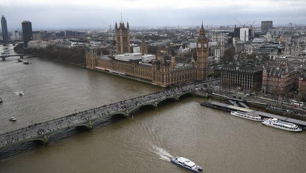 The Palace of Westminster, comprising the House of Commons and the House of Lords, wchich together make up the Houses of Parliament, are pictured on the banks of the River Thames alongside Westminster Bridge in central London on March 29, 2017 - Sputnik International