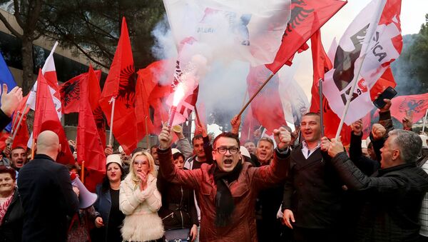Supporters of the Albanian opposition shout anti-Government slogans as they protest in front of the government building in Tirana on February 18, 2017 - Sputnik International