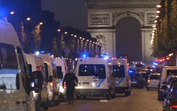 In this image made from video, police attend the scene after an incident on the Champs-Elysees in Paris, Thursday April 20, 2017. - Sputnik International