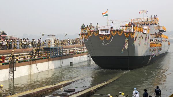 A Landing Craft Utility (LCU) ship rolls into the Ganges River as workers watch during its launching ceremony in Kolkata, India. (File) - Sputnik International