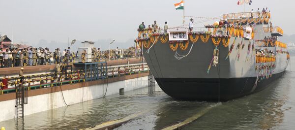 A Landing Craft Utility (LCU) ship rolls into the Ganges River as workers watch during its launching ceremony in Kolkata, India. (File) - Sputnik International