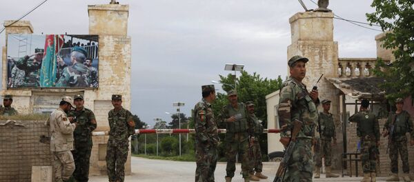 Afghan national Army (ANA) troops keep watch near the site of an ongoing attack on an army headquarters in Mazar-i-Sharif, northern Afghanistan April 21, 2017. Afghan national Army (ANA) troops keep watch near the site of an ongoing attack on an army headquarters in Mazar-i-Sharif, northern Afghanistan April 21, 2017. - Sputnik International