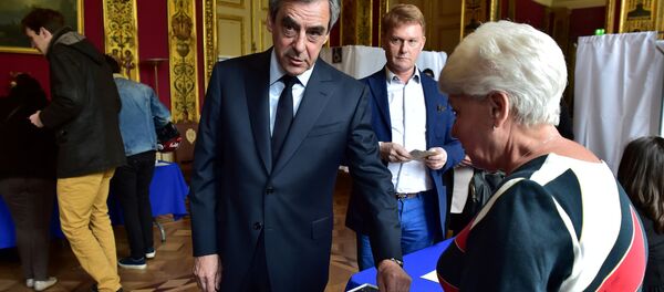 Francois Fillon (L), member of the Republicans political party and 2017 French presidential election candidate of the French centre-right, casts his vote in the first round of 2017 French presidential election in Paris, France, April 23, 2017. Francois Fillon (L), member of the Republicans political party and 2017 French presidential election candidate of the French centre-right, casts his vote in the first round of 2017 French presidential election in Paris, France, April 23, 2017. - Sputnik International