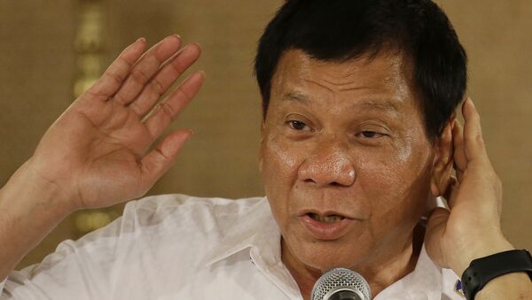 Philippine President Rodrigo Duterte gestures as he answers questions from reporters during a press conference - Sputnik International