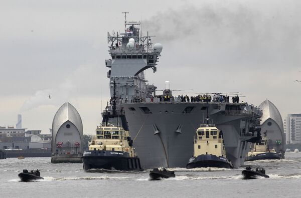 Royal Navy helicopters carrier HMS Ocean sails through the Thames Barrier on the River Thames in London to dock at Greenwich as part of London 2012 Olympic preparation security exercise, Friday, May 4, 2012. Royal Navy helicopters carrier HMS Ocean sails through the Thames Barrier on the River Thames in London to dock at Greenwich as part of London 2012 Olympic preparation security exercise, Friday, May 4, 2012. - Sputnik International