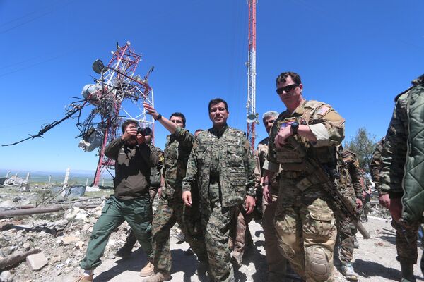 US military commander (R) walks with a commander (C) from the Kurdish People's Protection Units (YPG) as they inspect the damage at YPG headquarters after it was hit by Turkish airstrikes in Mount Karachok near Malikiya, Syria April 25, 2017. US military commander (R) walks with a commander (C) from the Kurdish People's Protection Units (YPG) as they inspect the damage at YPG headquarters after it was hit by Turkish airstrikes in Mount Karachok near Malikiya, Syria April 25, 2017. - Sputnik International