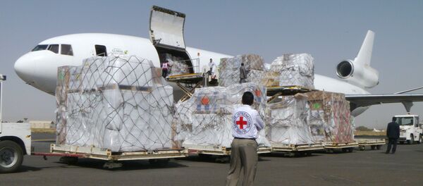 International Committee of the Red Cross workers unload a cargo plane carrying humanitarian relief supplies for civilians at the airport in Sanaa, Yemen (File) International Committee of the Red Cross workers unload a cargo plane carrying humanitarian relief supplies for civilians at the airport in Sanaa, Yemen (File) - Sputnik International