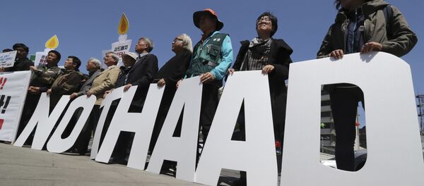 Protesters hold letters reading NO THAAD during a rally to oppose a plan to deploy an advanced U.S. missile defense system called Terminal High-Altitude Area Defense, or THAAD, near U.S. Embassy in Seoul, South Korea, Wednesday, April 26, 2017 Protesters hold letters reading NO THAAD during a rally to oppose a plan to deploy an advanced U.S. missile defense system called Terminal High-Altitude Area Defense, or THAAD, near U.S. Embassy in Seoul, South Korea, Wednesday, April 26, 2017 - Sputnik International