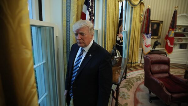 U.S. President Donald Trump stands in the Oval Office following an interview with Reuters at the White House in Washington, U.S., April 27, 2017 - Sputnik International