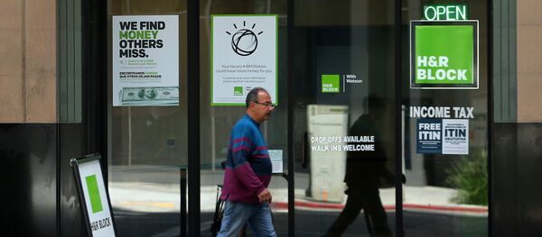 A pedestrian walks past a H&R Block tax office in Los Angeles, California, U.S., April 26, 2017 A pedestrian walks past a H&R Block tax office in Los Angeles, California, U.S., April 26, 2017 - Sputnik International