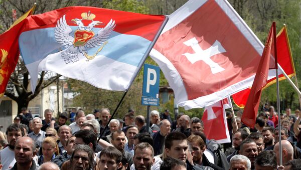 Demonstrators wave flags during anti-NATO protest as Montenegro’s parliament discusses NATO membership agreement in Cetinje, Montenegro, April 28, 2017 - Sputnik International