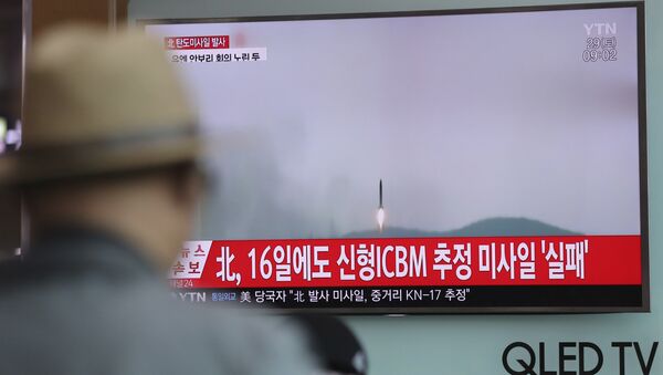A man watches a TV news program reporting about North Korea's missile firing with a file footage, at Seoul Train Station in Seoul, South Korea, Saturday, April 29, 2017. - Sputnik International