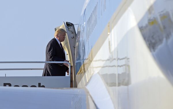 Trump walks up the steps the steps of Air Force One at Palm Beach International Airport in West Palm Beach, Fla. Trump walks up the steps the steps of Air Force One at Palm Beach International Airport in West Palm Beach, Fla. - Sputnik International
