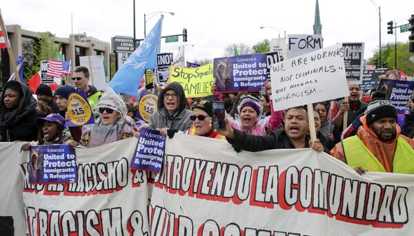 People participate in a May Day rally in Chicago, Monday, May 1, 2017. The demonstrations on May Day, celebrated as International Workers' Day, follow similar actions worldwide in which protesters from the Philippines to Paris demanded better working conditions. People participate in a May Day rally in Chicago, Monday, May 1, 2017. The demonstrations on May Day, celebrated as International Workers' Day, follow similar actions worldwide in which protesters from the Philippines to Paris demanded better working conditions. - Sputnik International