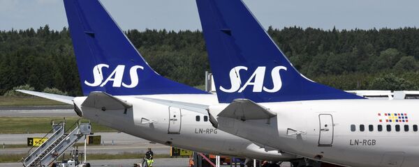 Two of Scandinavian airline (SAS) Boeing 737 aircrafts parked at Terminal 4 at Arlanda Airport in Stockholm, Sweden Two of Scandinavian airline (SAS) Boeing 737 aircrafts parked at Terminal 4 at Arlanda Airport in Stockholm, Sweden - Sputnik International