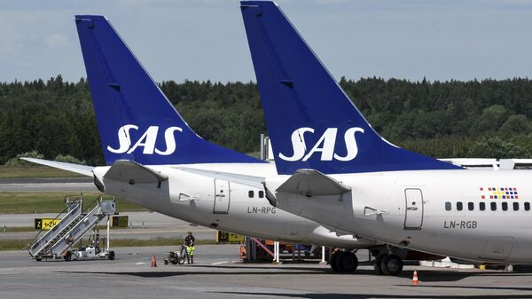 Two of Scandinavian airline (SAS) Boeing 737 aircrafts parked at Terminal 4 at Arlanda Airport in Stockholm, Sweden - Sputnik International