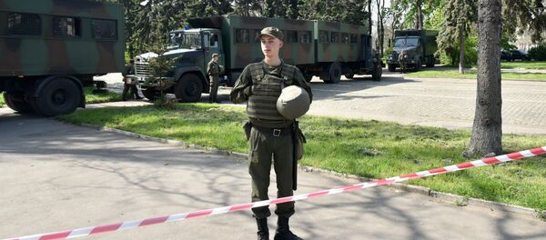 Odessa, Ukraine. A law enforcement officer on Kulikovo Polye Square during a memorial event honoring those killed in a May 2, 2014 fire at the local House of Trade Unions. Odessa, Ukraine. A law enforcement officer on Kulikovo Polye Square during a memorial event honoring those killed in a May 2, 2014 fire at the local House of Trade Unions. - Sputnik International